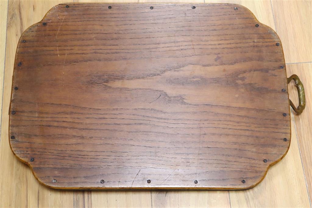 An Edwardian walnut and ebonised framed two handled tea tray, width 65cm